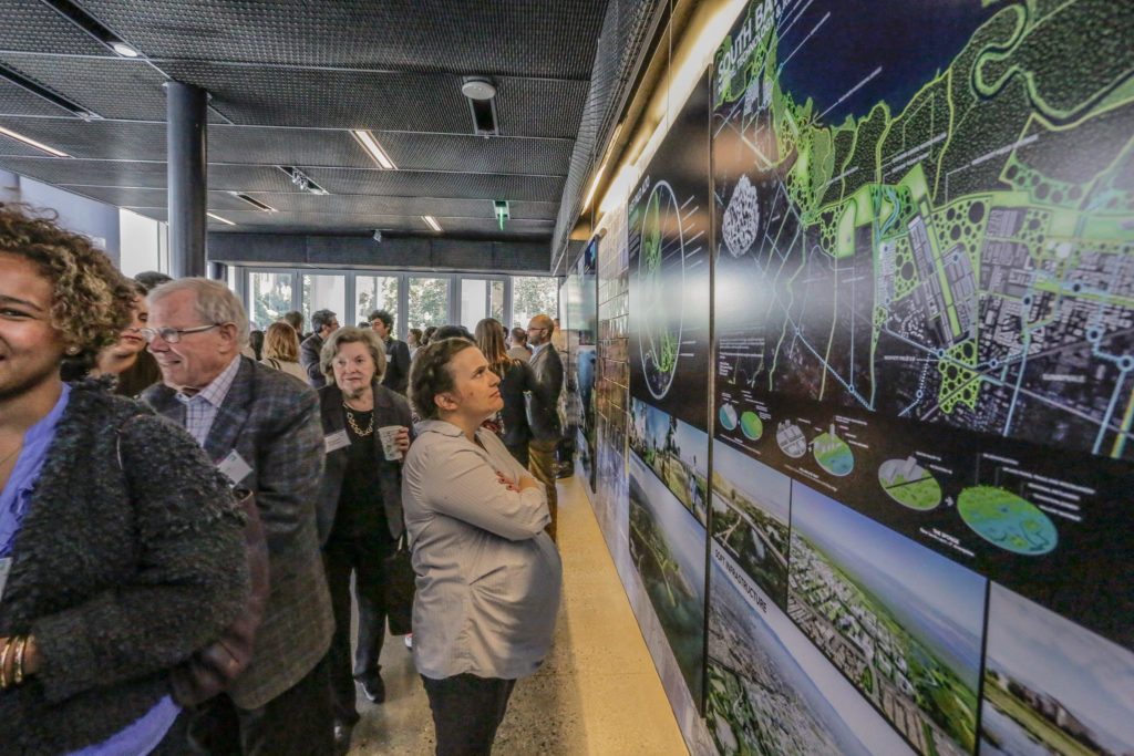 A guest viewing one of the Resilient By Design team's proposals to combat Bay Area sea level rise.