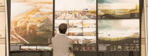 Man looking at maps and images at Resilient By Design event, in San Francisco.